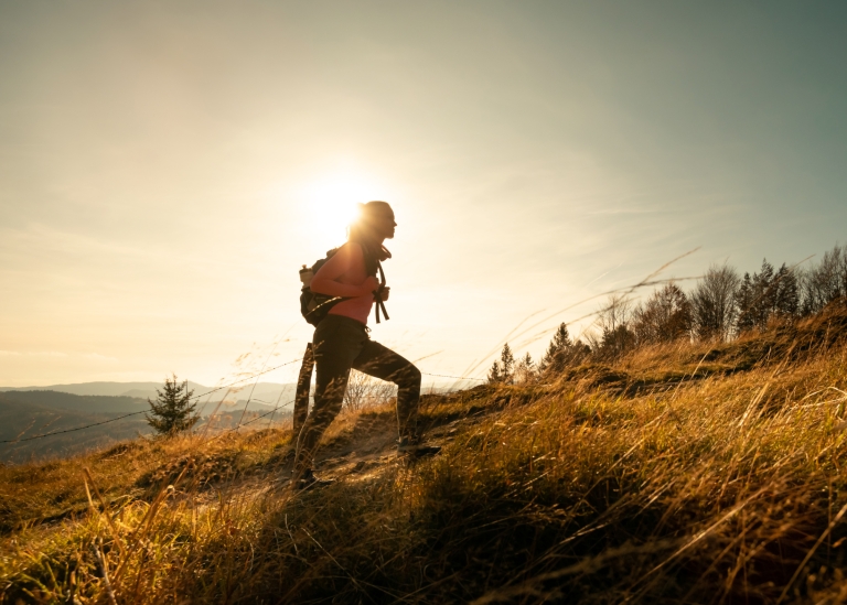 Female hiker enjoying a hike on her 3-day weekend.