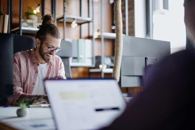 Man researching how to get a work visa in Algeria for his employees