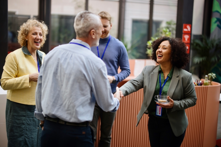 _People-greet-each-other-during-a-coffee break.jpg
