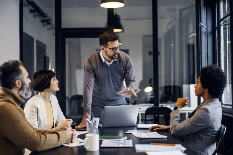 businessman-having-presentation-with-colleagues-about-project.jpg