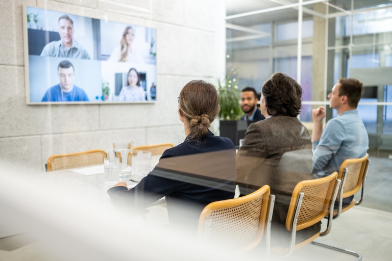 HR team discusses getting work visas in Malaysia in a video conference