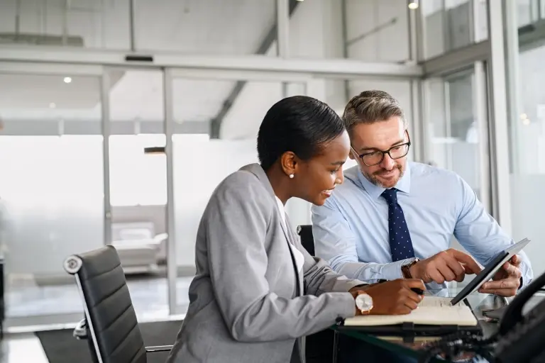 Business-people-working-on-tablet-in-modern-office.jpg