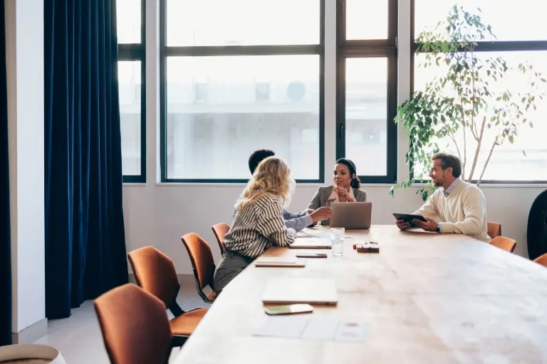 Professional-Team-Collaborating-at-Office-Meeting-Room.jpg