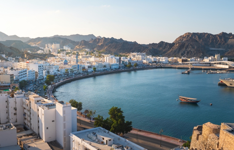 Aerial view of Muscat Oman surrounded by mountains