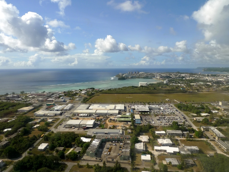 Aerial view of Guam with the ocean in the background