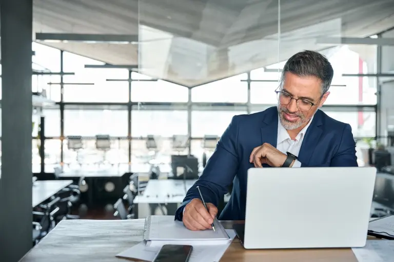 business-man-working-on-laptop-computer-in-office.jpg