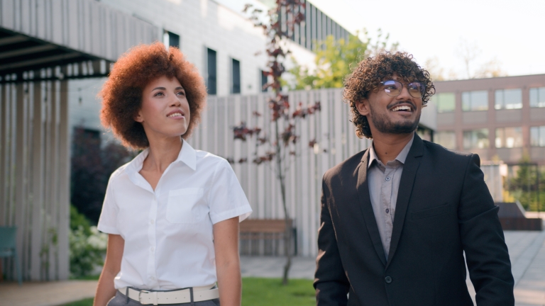 Global HR team members discussing Rwandan work visas outside