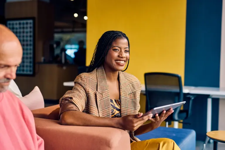 businesswoman-in-a-plaid-blazer-holding-a-tablet.jpg