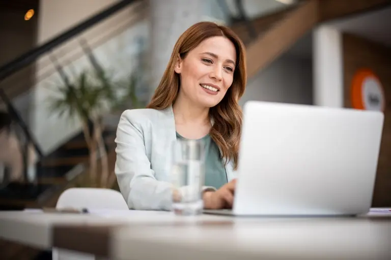 businesswoman-using-laptop-working-in-office.jpg