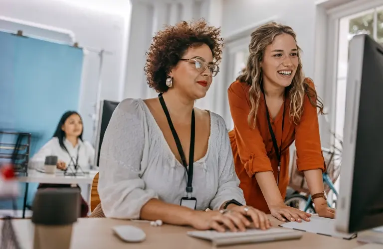 colleagues-working-together-on-desktop-computer .jpg