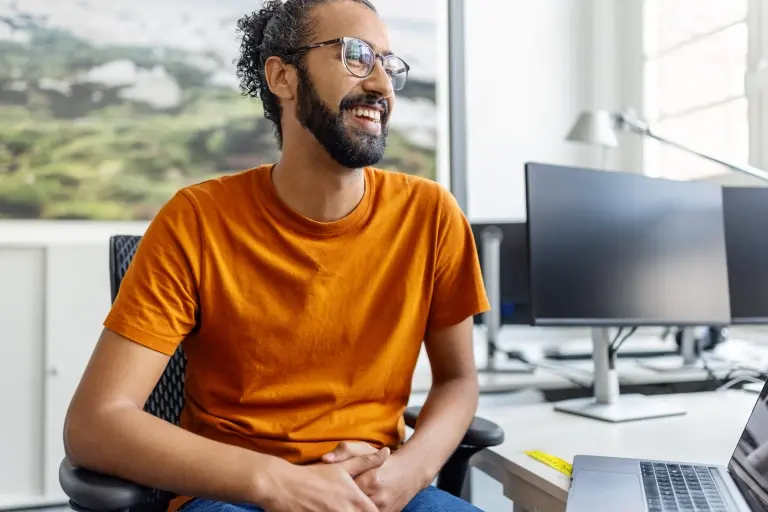 man-sitting-at-desk-at-office.jpg