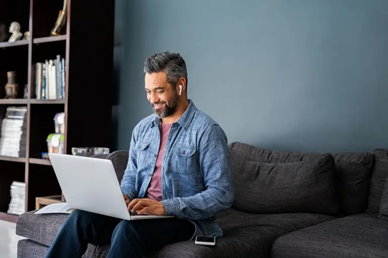 man-typing-on-laptop-while-working-from-home.jpg