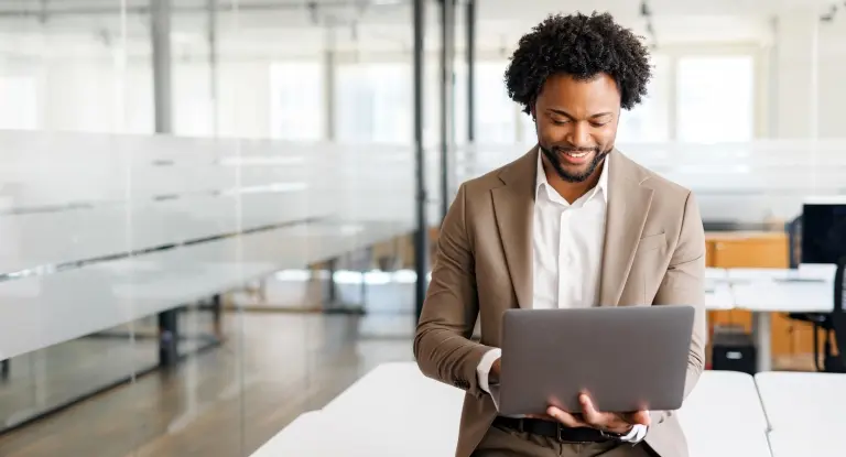 man-using-laptop-at-modern-office.jpg