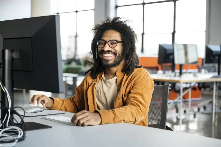 office-worker-at-desk-using-computer.jpg
