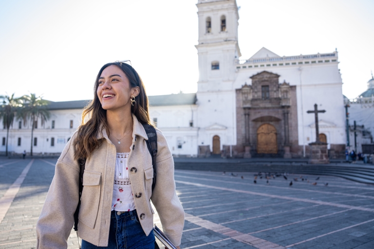 Woman standing in Santo Domingo church plaza in Quito Ecuador