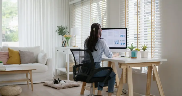 Woman-working-from-home-with-her-dog.jpg