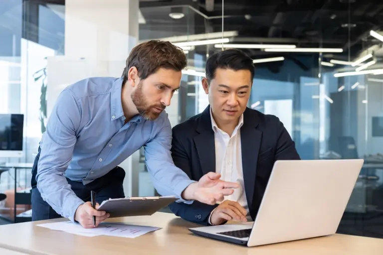 _two-business-people-discussing-strategy.jpg
