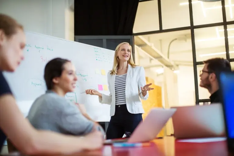 Businesswoman-giving-presentation-on-future-plans.jpg