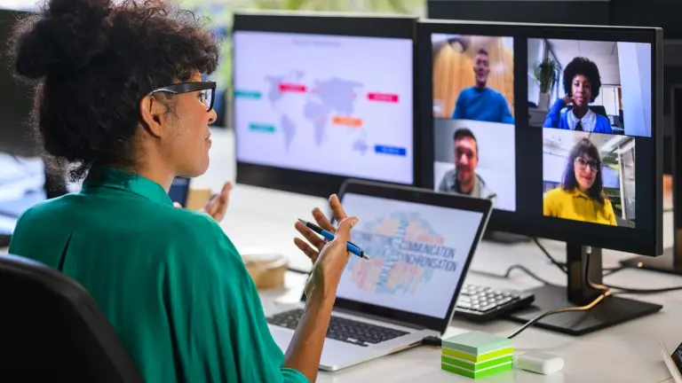 Woman-discussing-report-with-remote-workers.jpg