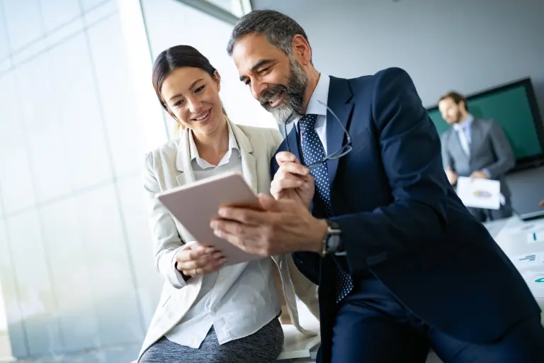 business-colleagues-in-modern-office-using-tablet.jpg