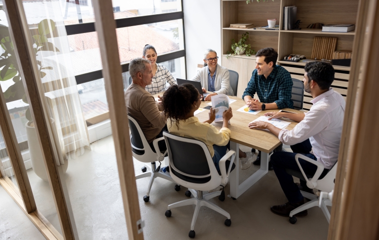 HR team discussing EOR strategies for temporary hiring