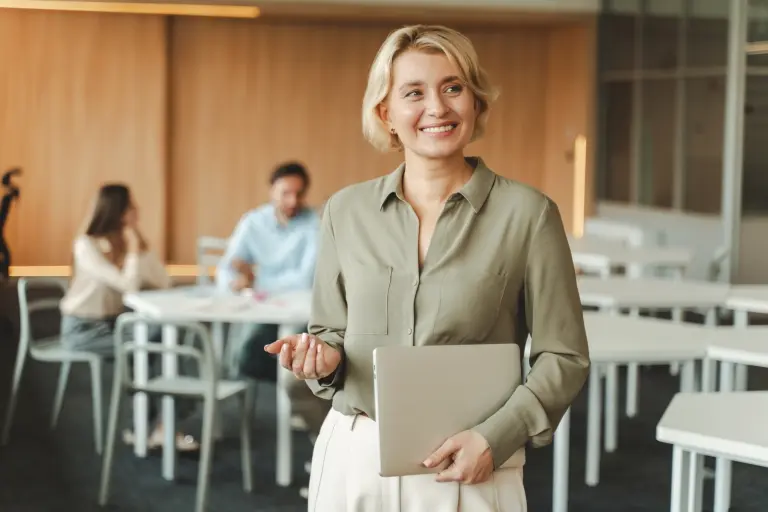 businesswoman-holding-laptop-working-in-modern-office.jpg