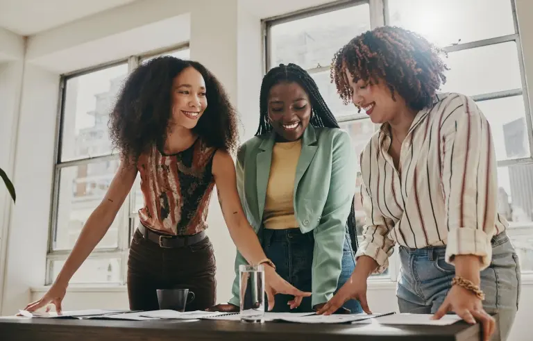 women-with-documents-working-on-strategy-in-office.jpg