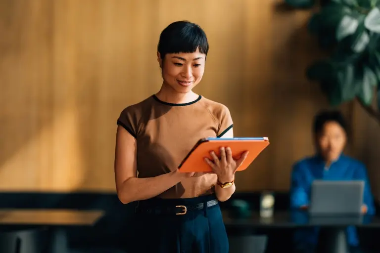 Businesswoman-Using-Digital-Tablet-in-Modern-Office.jpg