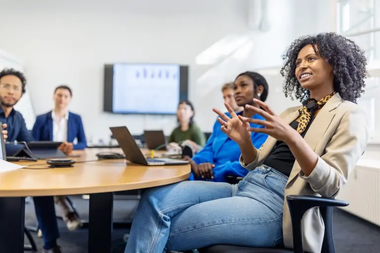 Businesswoman-explaining-her-ideas-to-colleagues-in-a-meeting.jpg