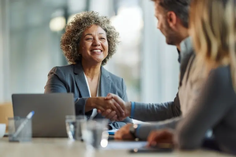 Happy-women-shaking-hands-with-her-colleagues.jpg