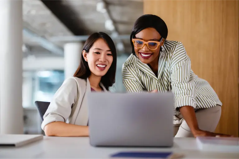 Professional-Women-Collaborating-on-a-Project.png