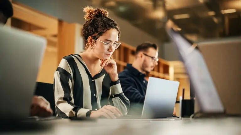 Woman-Working-on-Computer-in-a-Modern-Office.jpg
