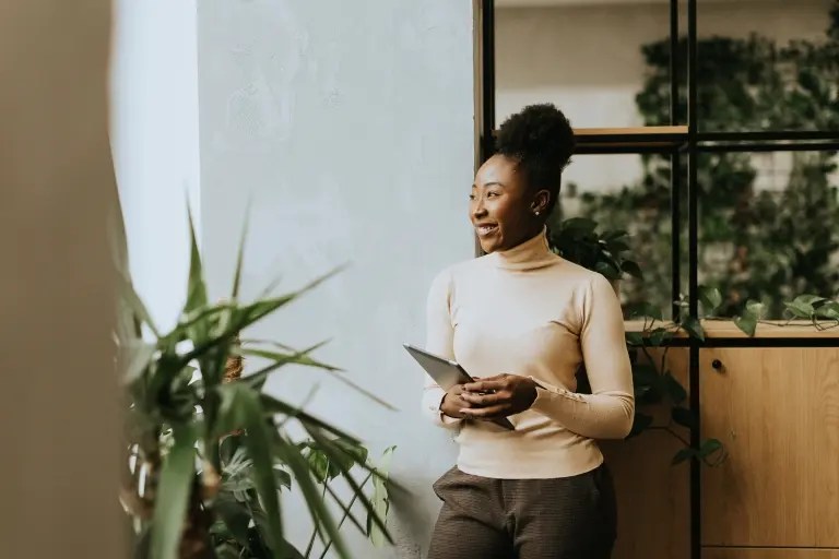 woman-standing-with-digital-tablet-at-the-office.jpg