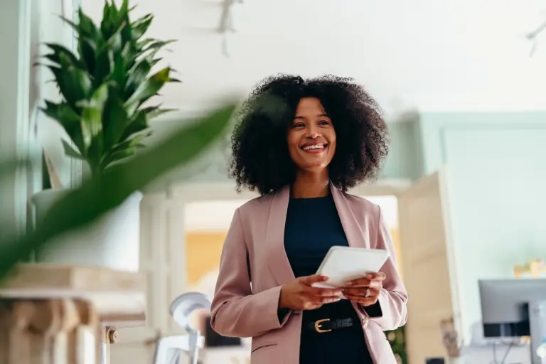 Smiling-businesswoman-holding-digital-tablet.jpg