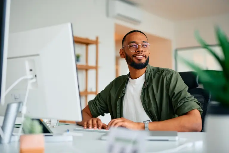 Young-businessman-working-on-computer.jpg