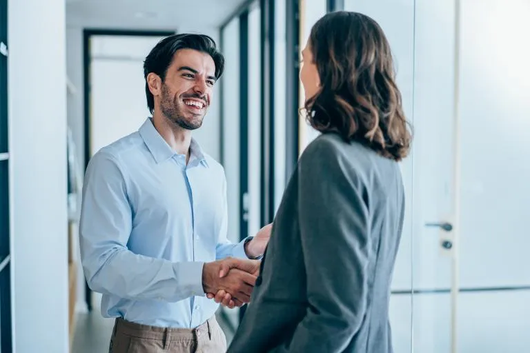 Business-people-shaking-hands-in-the-office.jpg