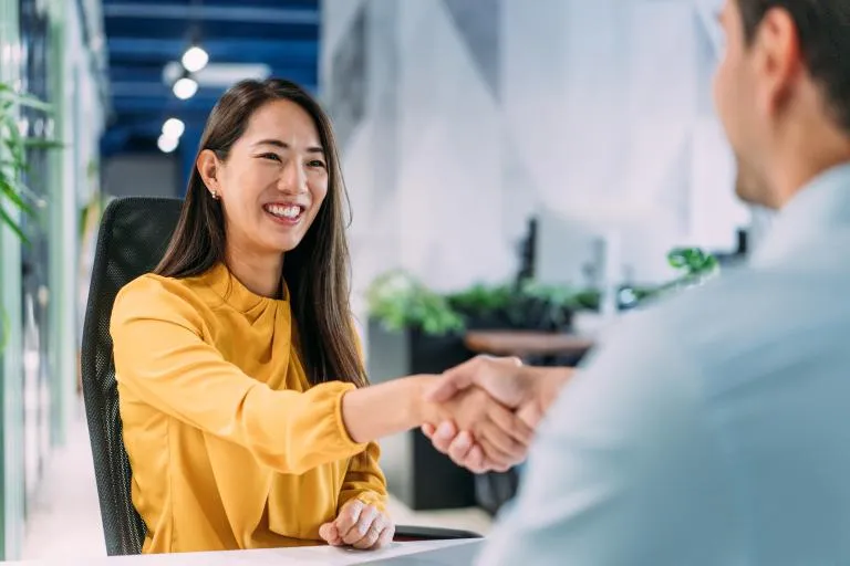 Businesswoman-shaking-hands-in-the-office.jpg