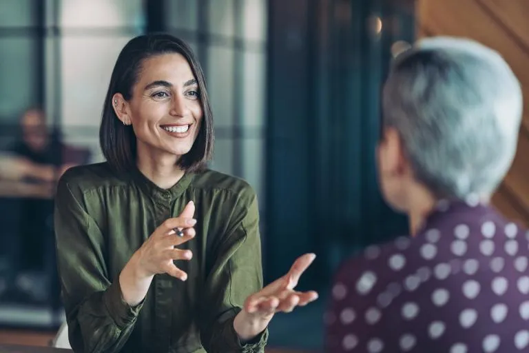 Two-businesswomen-talking-in-the-office.jpg