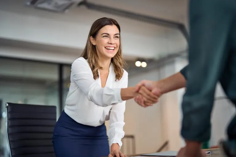 business-woman-handshaking-with-hiring-manager.jpg