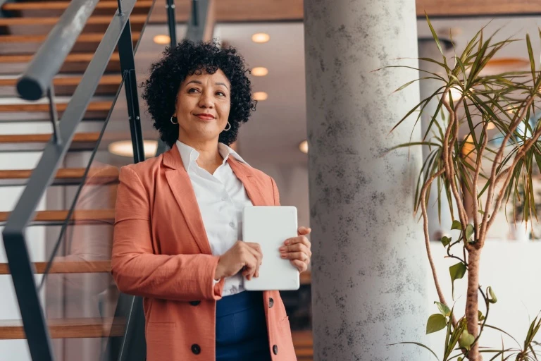 businesswoman-holding-tablet-in-modern-office.jpg