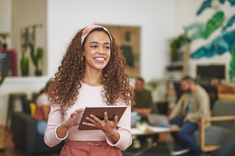 businesswoman-standing-in-the-office-and-using-a-digital-tablet.jpg