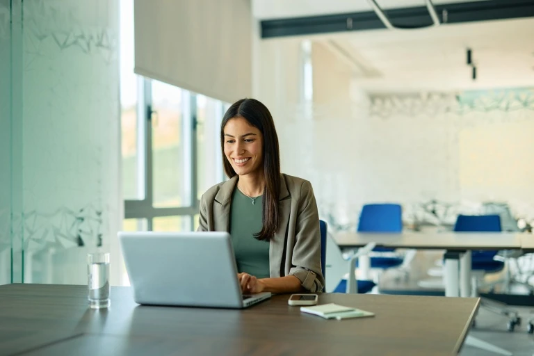 businesswoman-working-on-laptop-in-modern-office.jpg