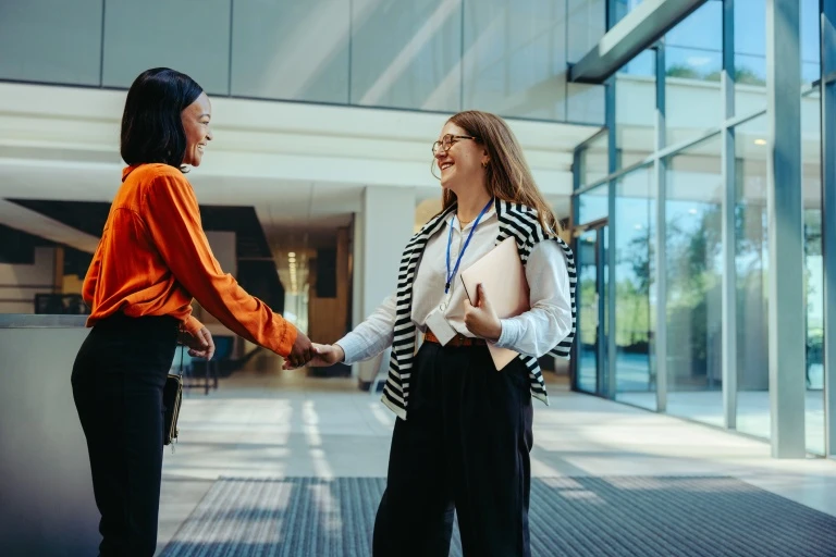 businesswomen-meeting-each-other-at-modern-office.jpg