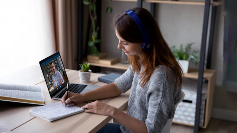 Blog-Image--Future-of-Work-Five-Trends-To-Watch-Over-the-Next-Five-Years Woman conducting virtual meeting while working remotely