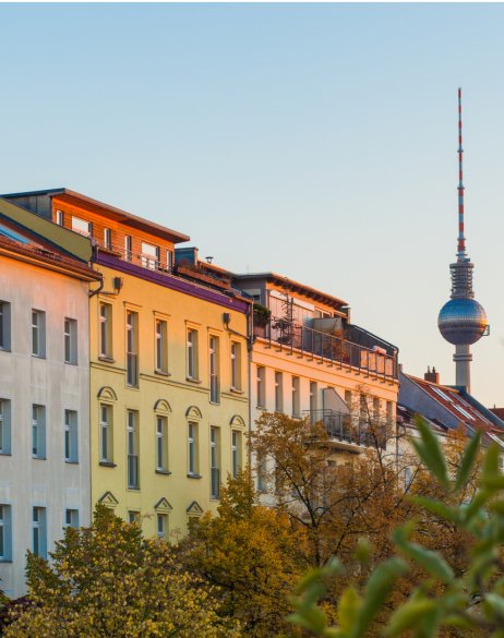 Tall apartment buildings with trees in foreground