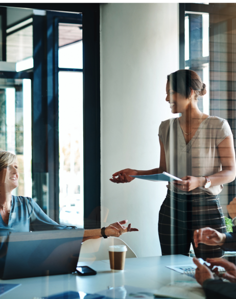 woman speaking to group of peers