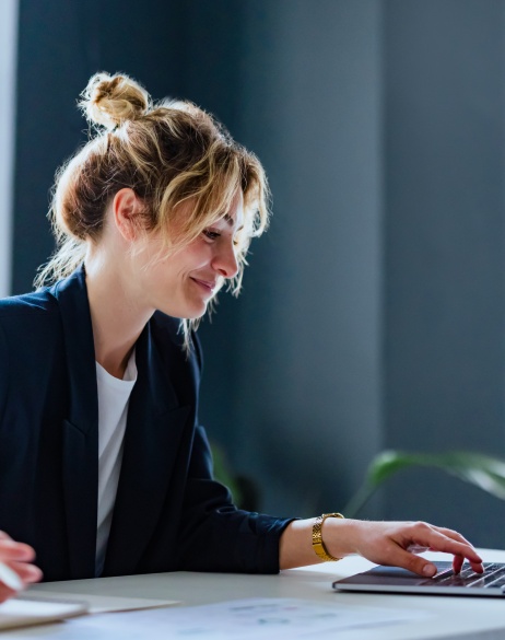 Female HR leader remotely facilitating virtual onboarding with a new hire from her laptop