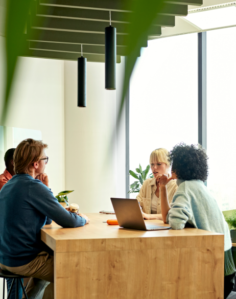 Co-workers discuss a project in a co-working space in Spain