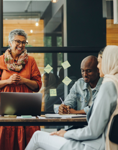 Professionals talking around a table in an office