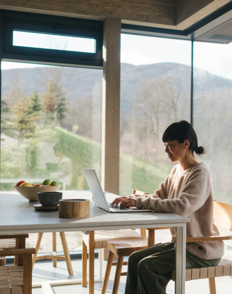 Global HR professional researching contractor management software on her laptop